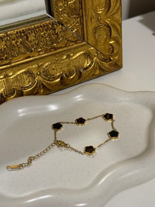 Pulsera tréboles oro y negro
