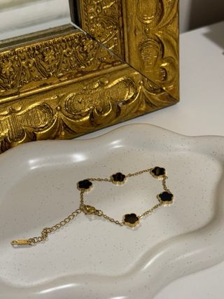 Pulsera tréboles oro y negro