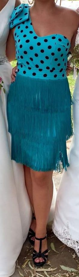 Conjunto de traje de flamenca con lunares y flecos
