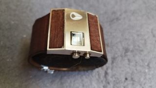 Reloj Nixon Rotolog Marrón y Plateado