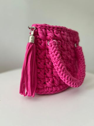 Bolso de mano tejido rosa