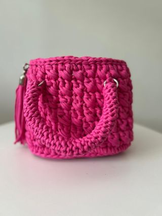 Bolso de mano tejido rosa