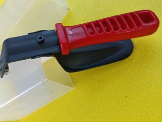 Raschietto manuale con impugnatura rossa