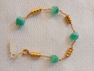 Pulsera laminada en oro de 18 K, con cuentas ver