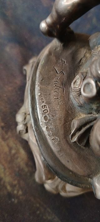 Portacandele vintage con putti in metallo