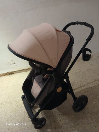 Cochecito de bebé rosa y gris