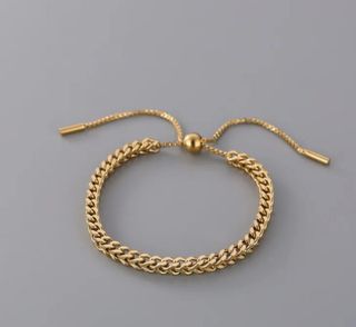 Pulsera eslabones dorada ajustable de acero .