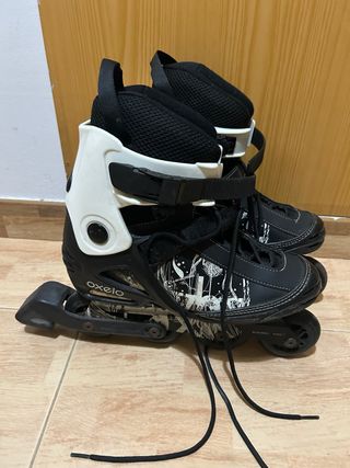 Patines Oxelo Negro Talla 42 más protecciones.