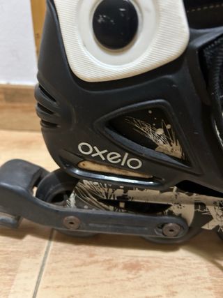 Patines Oxelo Negro Talla 42 más protecciones.