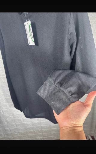 Polo negro manga larga hombre
