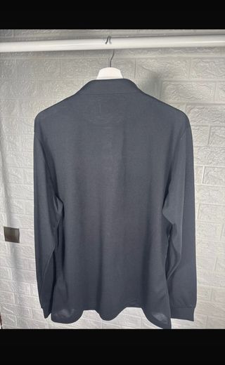 Polo negro manga larga hombre