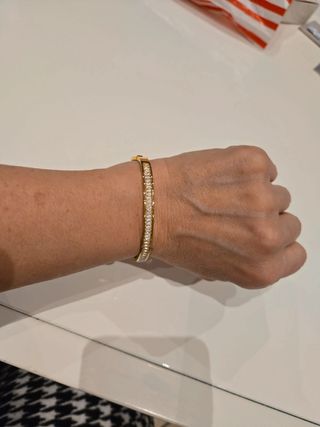 Bracciale rigido dorato con cristalli