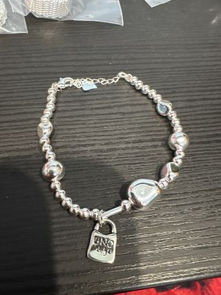 Pulsera plata Uno de 50 y 2 charm