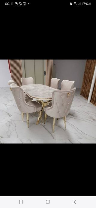 Mesa de comedor de mármol y metal dorado