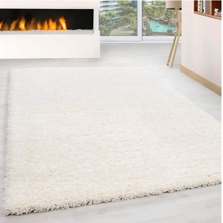 3 Alfombras de pelo largo blancas