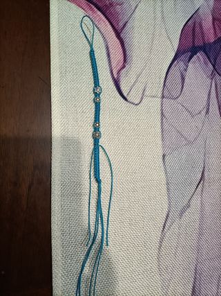 Bracciale intrecciato con ciondoli