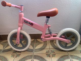 Bicicleta infantil rosa con amortiguación