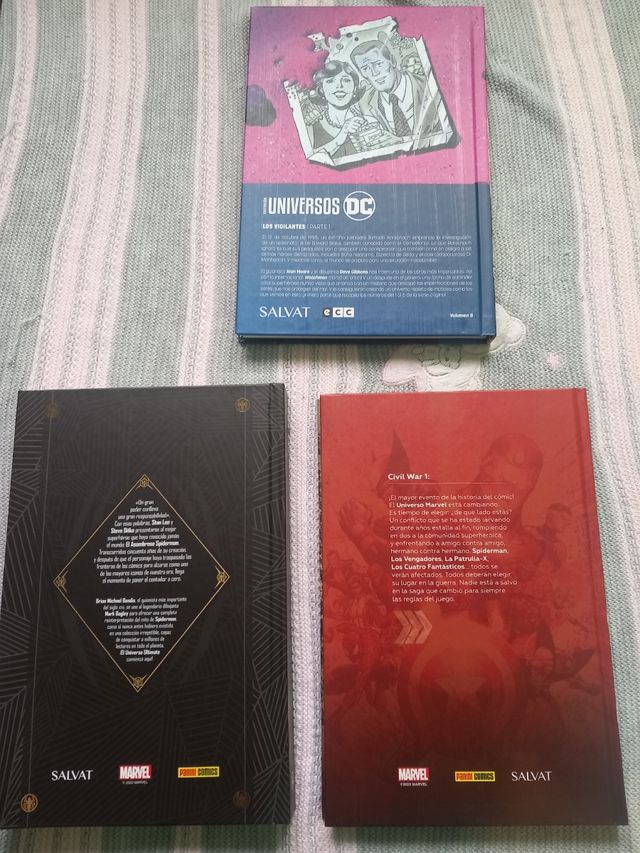 Cómic de spiderman, watchmen y civil war
