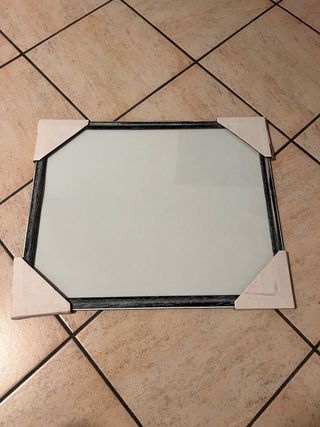 Cornice in legno con vetro