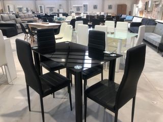 Mesa cristal y 4 sillas polipiel
