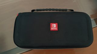 Nintendo Switch Lite Coral + Mario Kart 8 Deluxe