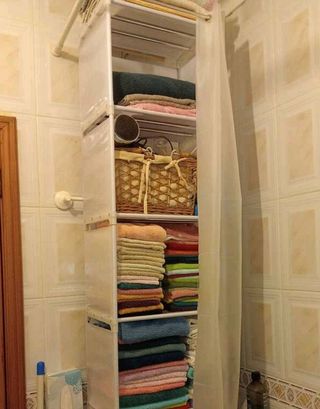 Armario estantes baño toallas auxiliar tela