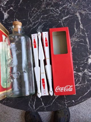 Set di bottiglie e ventagli di Coca Cola