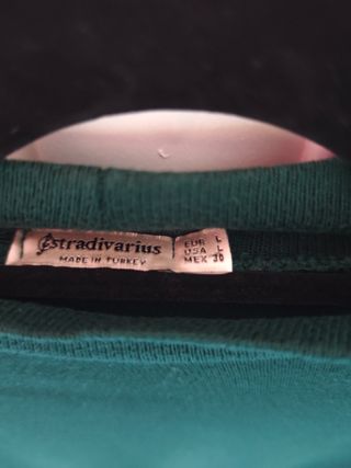 Jersey fino cuello alto manga abullonada