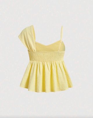 Blusa amarilla con nudo y volantes