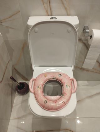 Orinal y adaptador asiento baño bebé