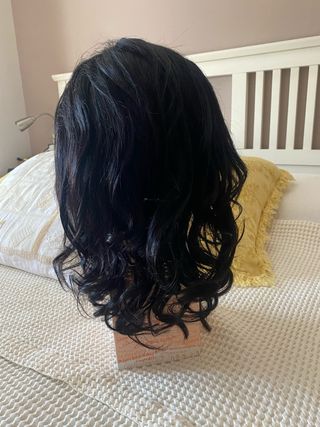 Peluca pelo natural negra sin usar