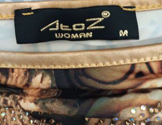 Blusa Alnaz manga larga dorada y negra Talla M