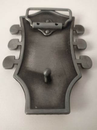 hebilla cinturon mastil guitarra