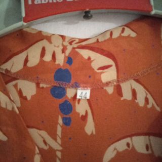 Abito arancione con stampa palme