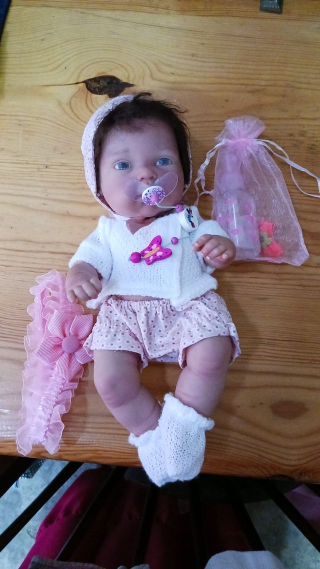 Muñeca bebé con accesorios