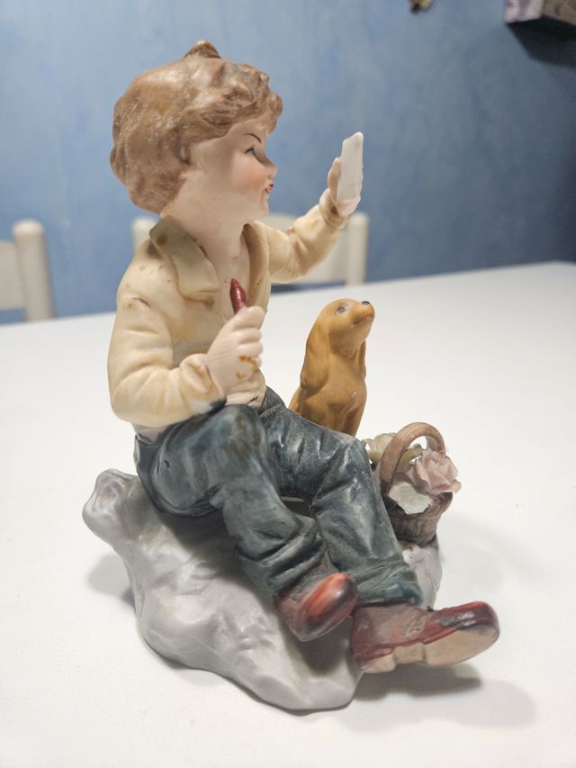 Statuina ceramica ragazzo e cane
