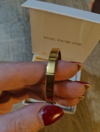 Pulsera rígida de oro y acero