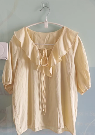 Blusa gasa con volantes y lazada