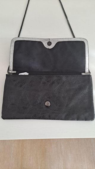 Bolso de mano negro y plata con estrellas