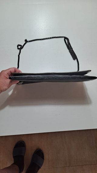 Bolso de mano negro y plata con estrellas