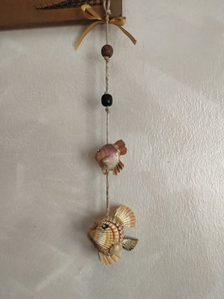 Segnavento marino con pesci