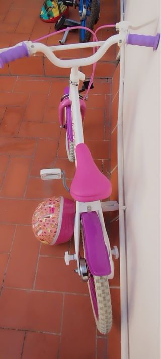 Bicicleta infantil rosa y blanca