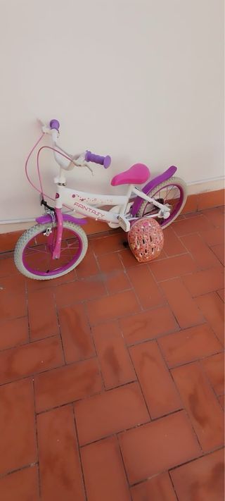 Bicicleta infantil rosa y blanca