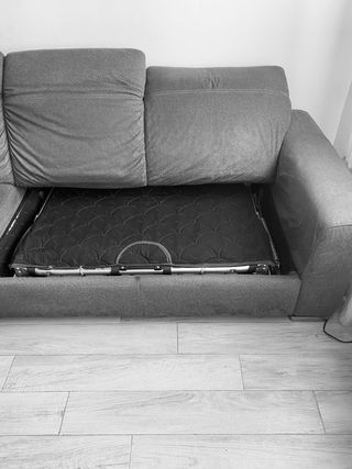 Sofá cama Natuzzi con chaise longue gris