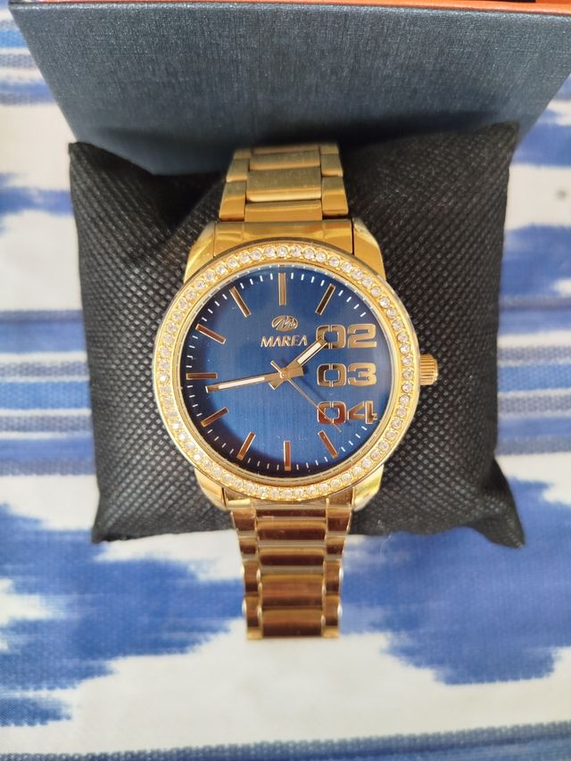 Reloj dorado Marea