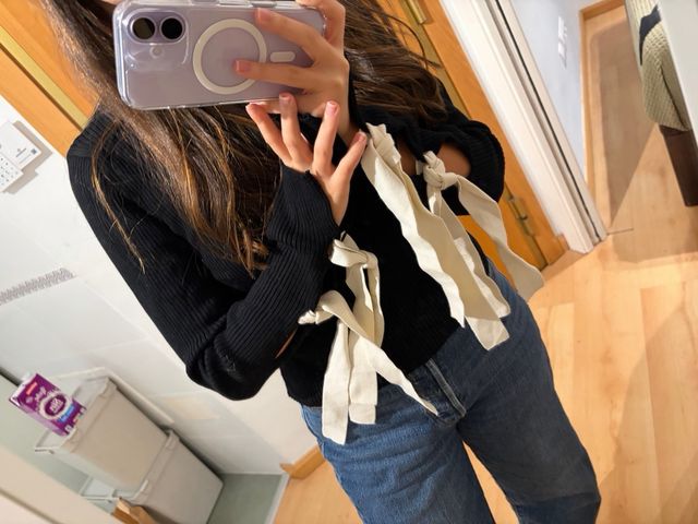 Jersey Zara negro con lazos en puños