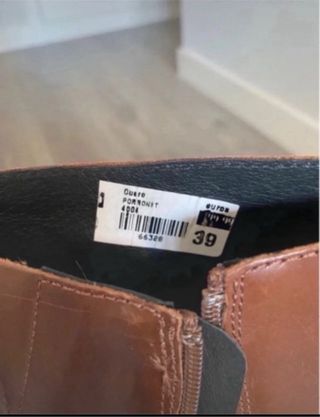 Botas altas de cuero marrón de la marca Porronet. 