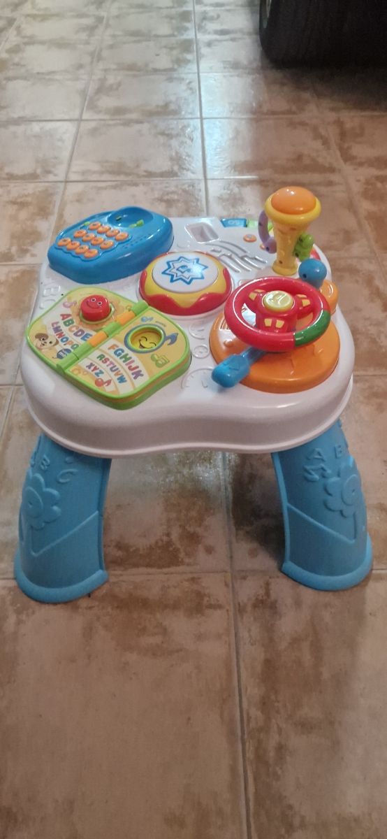 Mesa de actividades Infantil. Patinete Infantil.