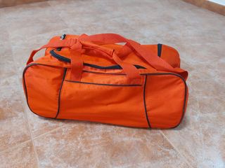 Bolso de viaje rojo anaranjado sin usar