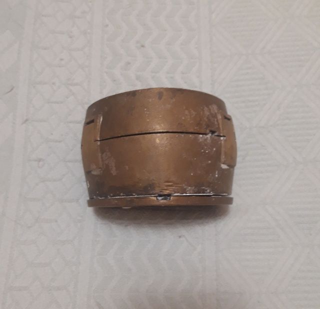 Mufla triangular de latón y abre muflas